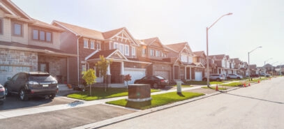 A row of two-story homes in a residential neighborhood.